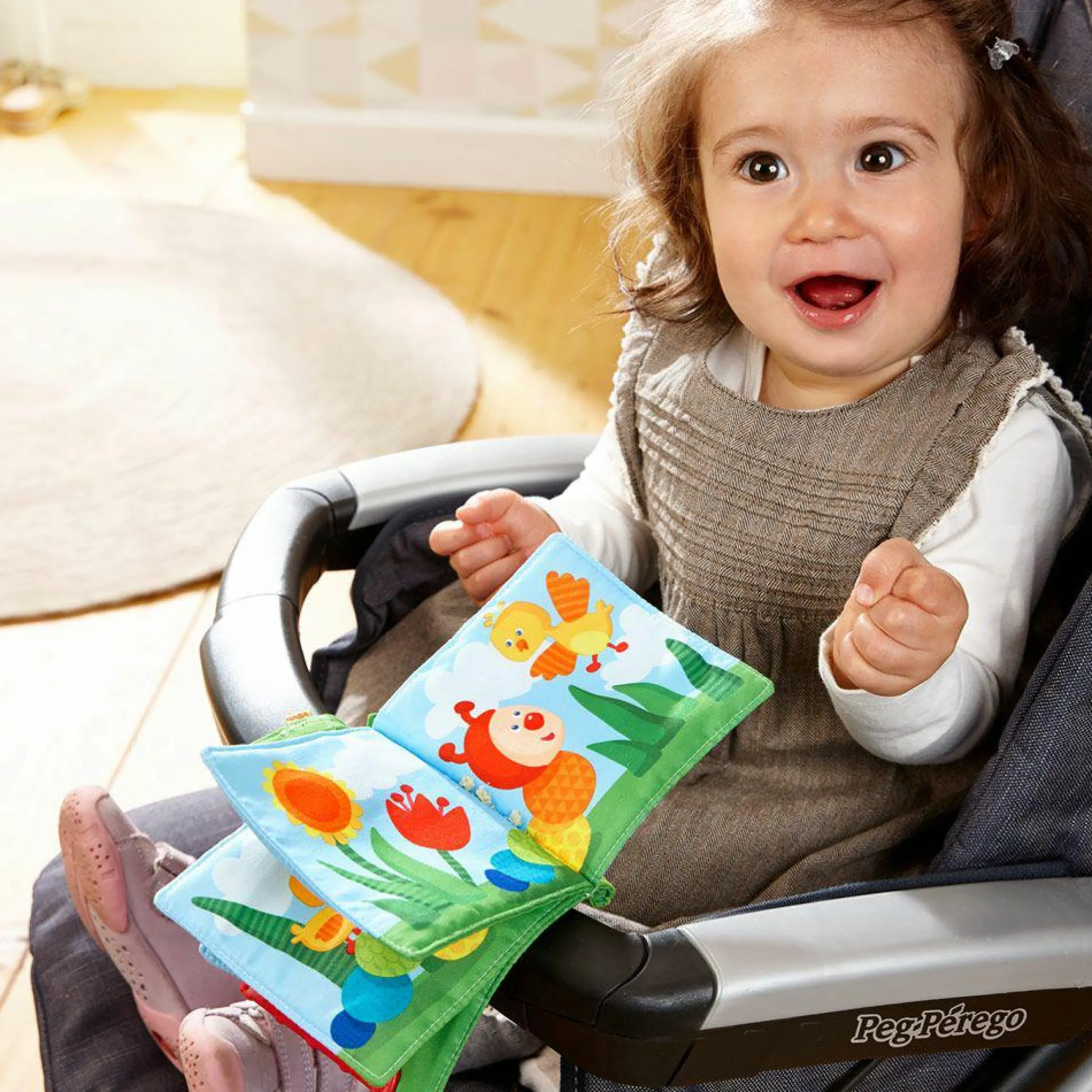 Buggybuch mit Beißecke - Regenbogen-Raupe - Grün